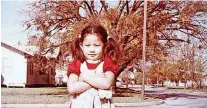  ?? [PHOTO PROVIDED] [PHOTO PROVIDED] ?? In this photo taken in an Oklahoma City neighborho­od, Vi Le is shown at age 4 or 5.In this photo taken at Vi Le’s first Holy Communion, she is flanked by her mother, Nghi Le, and father, Phuong Le, at Our Lady’s Cathedral in Oklahoma City. She was 7.