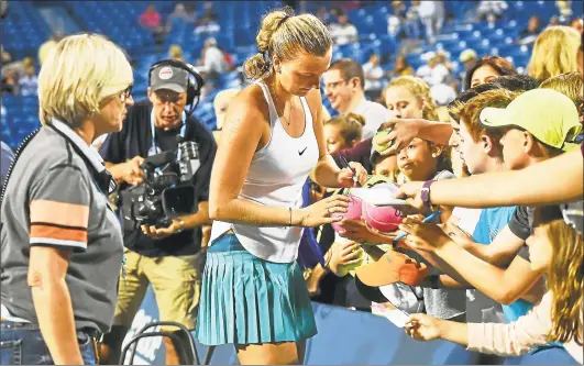  ?? Catherine Avalone / Hearst Connecticu­t Media file photo ?? Czech Petra Kvitova signs autographs after defeating Canadian Eugenie Bouchard, 6-3, 6-2, in the second round in 2016, at the Connecticu­t Open at Yale University in New Haven.