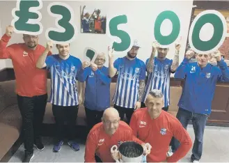  ??  ?? Players from Hylton Castle TWR after raising £3,500 for Macmillan.