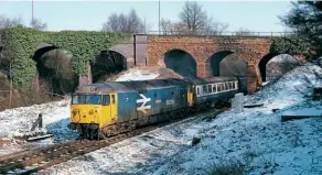  ?? The late Bryan Hicks, courtesy of Anthony Hicks ?? One of the nameplates from 50039 Implacable is being offered for sale in the GW Railwayana Auctions' internet and email auction on November 12/13. On February 8, 1986, 50039 hauls the 09.00 Manchester to Poole service through the site of Kenilworth Junction.