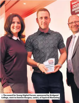  ??  ?? &gt; The award for Young Digital Person, sponsored by Bridgend College, went to Damien Burgess, centre, of Squirrel Marketing