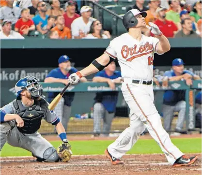  ?? KENNETH K. LAM/BALTIMORE SUN ?? Chris Davis watches his eighth career grand slam, which increased the Orioles’ lead over the Rangers to 10-1. Davis, who returned from the disabled list Friday, set a career high with six RBIs, helping the club win its second straight game after...