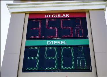  ?? MATT ROURKE — THE ASSOCIATED PRESS ?? Fuel prices are posted at a filling station in Willow Grove, Pa., on Tuesday. The White House on Tuesday said it had ordered 50million barrels of oil released from strategic reserve to bring down energy costs.