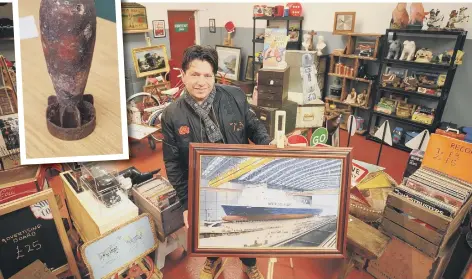  ??  ?? Flav Cipriano in his Nostalgia Lounge store in Fengate and inset, the Second World War mortar bomb he bought