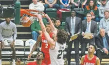  ?? Michael Brian, for the Loveland Reporter-herald ?? Colorado State’s Logan Ryan dunks against New Mexico on Saturday at Moby Arena.