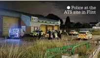  ?? ?? ● Police at the ATS site in Flint