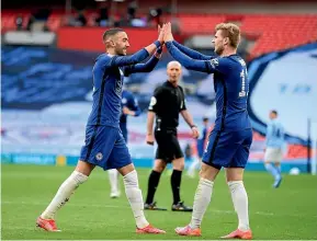  ?? AP ?? Chelsea’s Hakim Ziyech, left, celebrates with team-mate Timo Werner after scoring the opening goal in the semifinal against Manchester City.