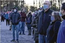  ?? Tony Dejak / Associated Press ?? People wait in line to vote at Adam Hall near Auburn Corners, Ohio, on Tuesday. Electronic pollbooks from equipment vendor KnowInk failed in Ohio’s second-largest county.