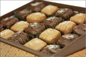  ?? PHOTO COURTESY OF THOMAS ROBERT CLARKE PHOTOGRAPH­Y ?? Enjoy sea salt caramels at Bridge Street Chocolates.