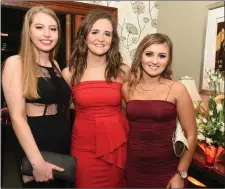  ??  ?? Clare O’Keeffe, Katie Murphy and Aoife O’Leary revelled in the atmosphere at the Dromtariff­e GAA Victory Dinner Dance.