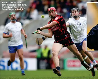  ?? ?? Focus: Cork’s Ciaran Joyce gets his shot away (main) and Déise boss Davy Fitzgerald (right)