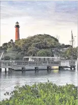  ?? LIZ BALMASEDA / ?? The Jupiter Lighthouse can be seen from the Rustic Inn Crabhouse in Jupiter. Developer Charles Modica bought the Rustic Inn property for $8.3 million last month. It’s just west of the Love Street parcel where Modica plans to build an outdoor...