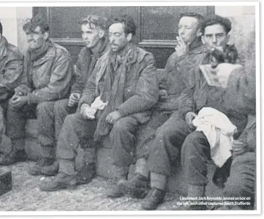  ??  ?? Lieutenant Jack Reynolds, seated on box on the left, with other captured South Staffords