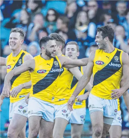  ?? Picture: AAP IMAGES ?? Richmond players celebrate the win over Fremantle, which goes a long way towards booking a spot in the four.