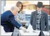  ?? ANDREW HARNIK/AP ?? President Trump, with first lady Melania Trump and Rabbi Jeffrey Myers, places a stone at a memorial for those killed.