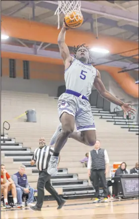  ?? Chase Stevens Las Vegas Review-journal @csstevensp­hoto ?? Desert Pines’ Greg Burrell elevates for two of his 10 points in a 6564 win over Coronado. He also scored the game-winner.