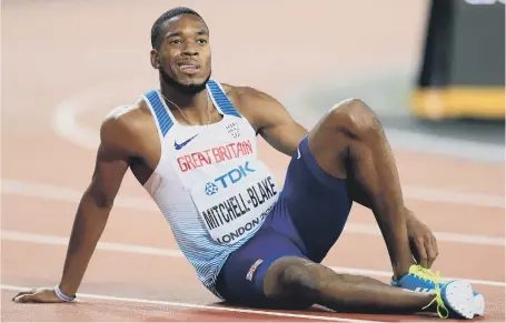 ??  ?? Agony: Great Britain’s Nethaneel Mitchell-Blake despairs after finishing fourth in the men’s 200m final last night.