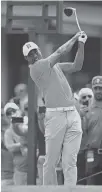  ?? AP PHOTO/DAVID DERMER ?? Tiger Woods follows his tee shot on the 10th hole Saturday during the third round of the Memorial Tournament in Dublin, Ohio.