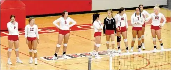  ?? MARK HUMPHREY ENTERPRISE-LEADER ?? The 2020 Farmington volleyball team comes out for introducti­ons prior to its Monday match against Paris at Cardinal Arena. The Lady Cardinals lost in straight sets (25-17, 25-22, 25-19).