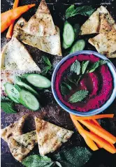  ??  ?? Roasted beets add a vivid twist to hummus.