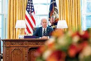  ?? AP Photo/Andrew Harnik ?? ■ President Joe Biden speaks before signing the American Rescue Plan, a coronaviru­s relief package, on March 11 in the Oval Office of the White House in Washington.