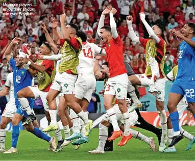  ?? ?? Morocco players enjoy their shock win over Belgium