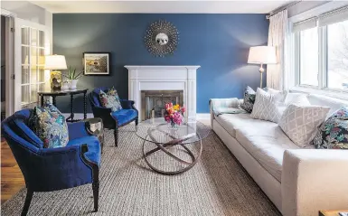  ??  ?? Painting a room or just a wall in a deep colour like this gorgeous navy (Farrow and Ball’s Stiffkey Blue), is a great way to cosy up a room, designer Emma Doucet says.