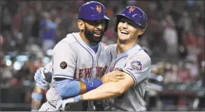  ?? Norm Hall / Getty Images ?? The Mets’ Brandon Nimmo celebrates his homer with teammate Jose Bautista Sunday.