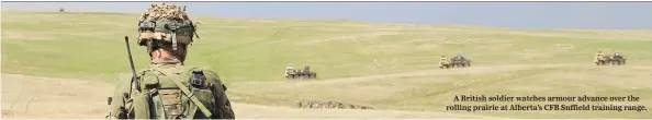  ??  ?? A British soldier watches armour advance over the rolling prairie at Alberta’s CFB Suffield training range.