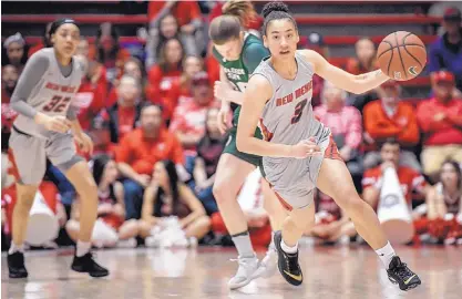  ?? ROBERTO E. ROSALES/JOURNAL ?? Ahlise Hurst of the Lobos runs up the court after intercepti­ng a Colorado State pass Saturday afternoon at Dreamstyle Arena.