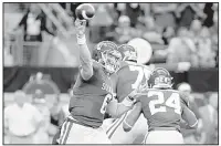  ?? AP/TONY GUTIERREZ ?? Oklahoma quarterbac­k Baker Mayfield (6) is one of three finalists for the Heisman Trophy. The other two are Louisville quarterbac­k Lamar Jackson, who won the award last year, and Stanford running back Bryce Love.