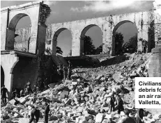  ??  ?? Civilians clear debris following an air raid on Valletta, Malta