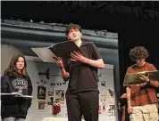  ?? Elise Petro / Contribute­d photo ?? Torrington High School students rehearse for “Sawyer Logan Is Doing Just Fine,” written by student Maia Wood. Reed Freiler who plays Sawyer Logan center, projects a monologue, with other cast members listening.