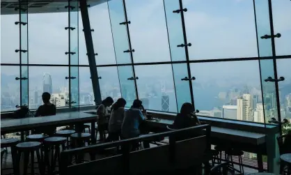  ??  ?? People sit in a Hong Kong cafe in March. Some people said they would denounce people who ate at restaurant­s known to back the prodemocra­cy movement, RTHK reported. Photograph: Billy HC Kwok/Getty Images