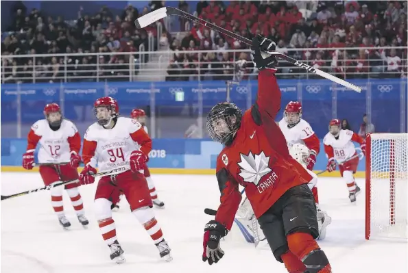  ?? RONALD MARTINEZ/GETTY IMAGES ?? Melodie Daoust celebrates after scoring a goal in the second period against Olympic Athletes from Russia on Sunday. With a mix of 14 veterans and nine rookies on the roster, the Canadians were relentless, methodical­ly wearing the Russians down and...