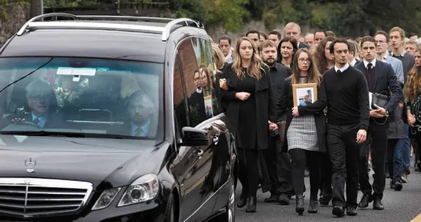  ??  ?? ‘FAMILY MAN’: Mourners attend Michael McCoy’s funeral in St Maelruain’s Anglican Church in Tallaght yesterday. Photo: Tony Gavin. Below, Michael McCoy