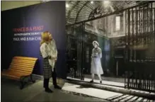  ?? ERIC RISBERG — THE ASSOCIATED PRESS ?? In this photo taken Wednesday curator Katie Pratt looks over the entryway to the exhibit called, “France is a Feast - The Photograph­ic Journey of Paul and Julia Child,” at the Napa Valley Museum in Yountville The exhibit features rarely seen...