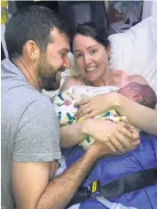  ??  ?? Joyous: Lisa and Emmett Leavey with baby Michael