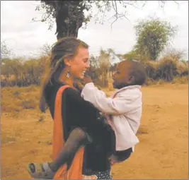  ?? PHOTO COURTESY OF JENNIFER ASPINWALL ?? Jennifer Aspinwall with Meeli, a member of the host family she stayed with when she visited Kenya.