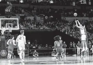  ?? Tim Nwachukwu / Getty Images ?? Gonzaga’s Jalen Suggs releases the game-winning 3-point shot just before the overtime buzzer to defeat UCLA in the second Final Four semifinal on Saturday in Indianapol­is.