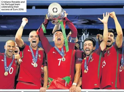  ??  ?? Cristiano Ronaldo and his Portugal team celebratin­g their success at Euro 2016