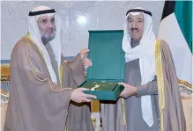  ??  ?? KUWAIT: His Highness the Amir Sheikh Sabah Al-Ahmad Al-Jaber Al-Sabah receives the 2016 statistica­l manual of the Ministry of Public Works’ projects from Minister Abdurrahma­n Al-Mutawa.