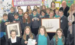  ??  ?? Glenbervie P5/6 pupils with the portrait of Burns and the original design diagram for the Cutty Sark. Murray Taylor holds the Father of the Bard trophy he won in the Burns and Scottish week competitio­n this year.