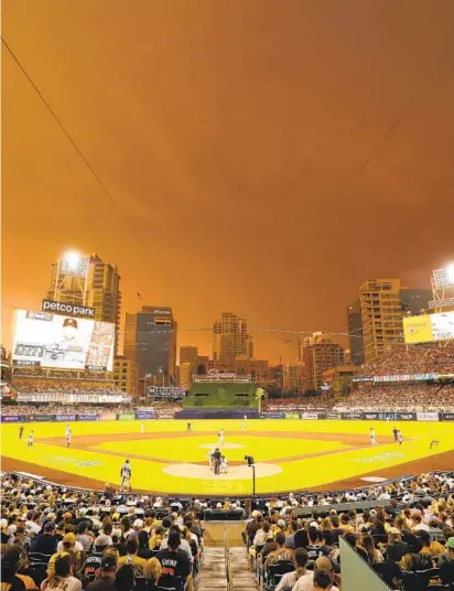  ?? K.C. ALFRED U-T ?? The Padres hosted the San Francisco Giants at Petco Park as a thundersto­rm moved into the area on Monday night.