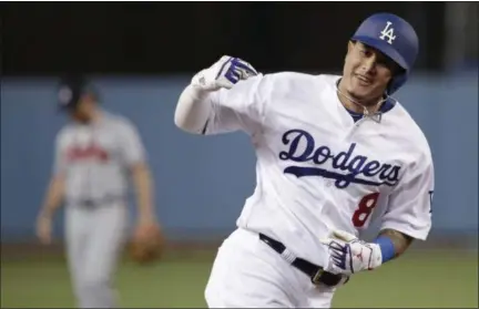  ?? JAE C. HONG - THE ASSOCIATED PRESS ?? FILE - In this Oct. 5, 2018, file photo, then-Los Angeles Dodgers’ Manny Machado celebrates his two-run home run against the Atlanta Braves during the first inning of Game 2 of the National League Division Series, in Los Angeles.