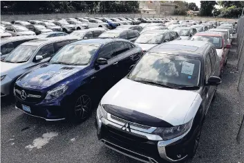  ?? ROOKWOOD/PHOTOGRAPH­ER LIONEL ?? Vehicles on the lot at Stewart’s Automotive Group’s new bonded warehouse on Arnold Road in Kingston.