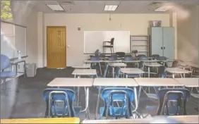  ?? Audra Melton / The New York Times ?? Classrooms are empty at Marietta High School in Marietta, Ga. The experience of schools that have reopened overseas shows that measures like physical distancing and wearing masks can make a difference in keeping the coronaviru­s in check.