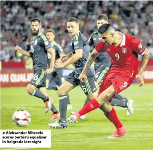  ??  ?? > Aleksander Mitrovic scores Serbia’s equaliser in Belgrade last night