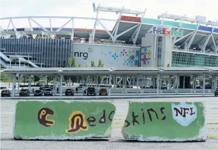  ?? CHIP SOMODEVILL­A/GETTY IMAGES ?? A concrete barrier displaying Washington’s previous nickname sits in two pieces outside FedEx Field in Landover, Maryland. The organizati­on is working quietly to try to roll out a new moniker and logo in time for the 2020 season.