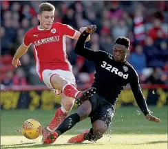  ??  ?? BATTLE: Barnsley’s Joe Williams and Leeds’ Caleb Ekuban tussle